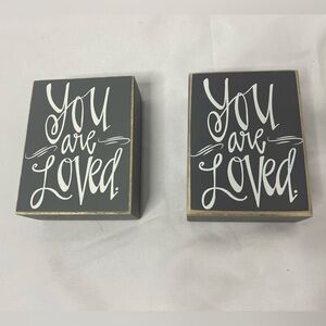 2 “You are loved” signs